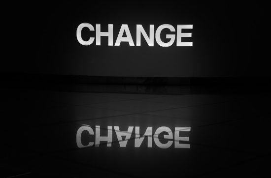 a black and white photo of the word change