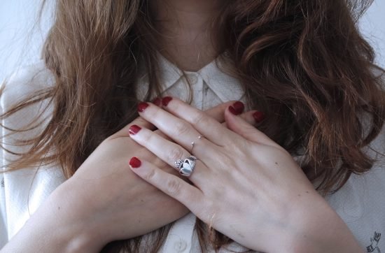 woman wearing silver-colored ring