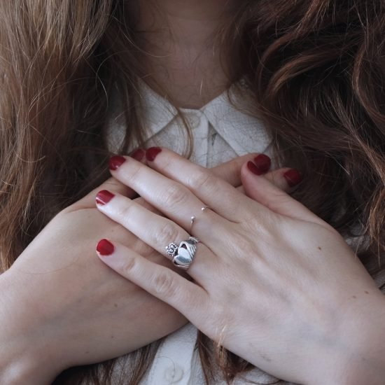 woman wearing silver-colored ring